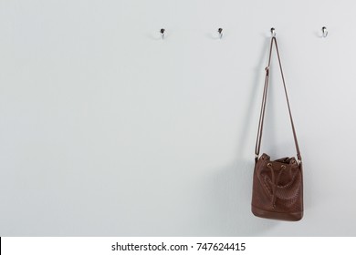 Bag hanging on hook against wall