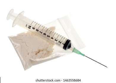 Bag Of Heroin And Syringe In Close-up On White Background