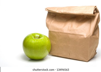 A bag lunch with a Granny Smith apple. - Powered by Shutterstock