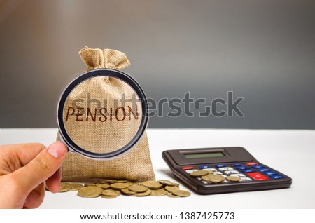 A bag with money and the word Pension and calculator. Pension payments. Help from the state. Accumulation and saving money. Accumulation of pension contributions / enrichment capital.