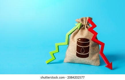 Bag With Oil Barrel And Up Down Arrows. Energy Crisis. Unstable Power-generating And Fuel Prices. Chemical And Transport Industries. Speculation On Stock Exchange. Imbalance Global Supply And Demand.