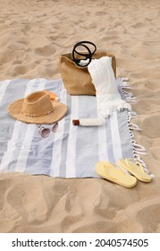 Bag And Other Beach Items On Sand