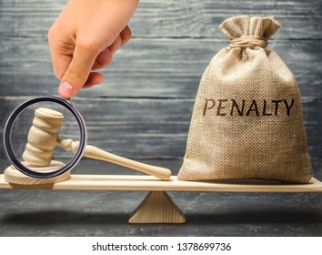 Bag with the word Penalty and gavel on the scales. Penalty as a punishment for a crime and offense. Fraud. The court's decision. Appeal. Cancellation of fines and financial penalties. Litigation