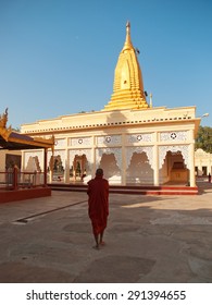 Bagan, Myanmar - February 25, 2011 : Young Monk Walking Barefoot Inside Shwezigon Pagoda In Bagan