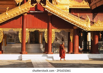 Bagan, Myanmar - February 25, 2011 : Young Monk Walking Barefoot Inside Shwezigon Pagoda In Bagan