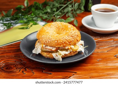 Bagel with chicken, cucumber and cabbage. Breakfast. - Powered by Shutterstock