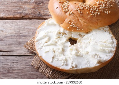 Bagel With Cream Cheese And Sesame Close-up On The Table. Top View Of The Horizontal 