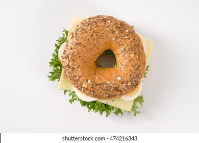 Bagel Sandwich With Eggs And Cheese On White Background