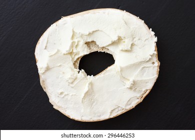 Bagel Spread With Cream Cheese. Isolated On Black Wood From Above.