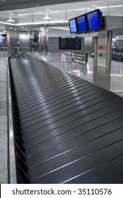 Baggage Carousel At The Airport. Baggage Claim.