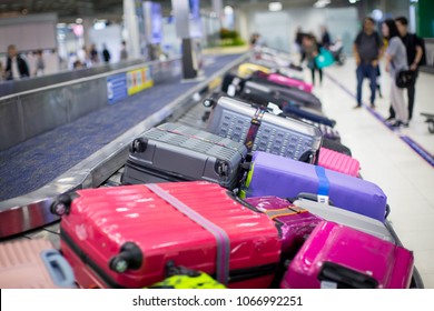 baggage on carousel at the airport  - Shutterstock ID 1066992251