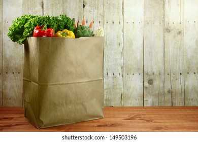 Bagged Grocery Produce Items On A Wooden Plank