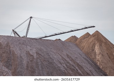 Bagger operation in surface mine. A backloader and a bucket wheel excavator in a lignite mine. Industrial stone production, crushed stone production, stone mining, crushed stone mining plant