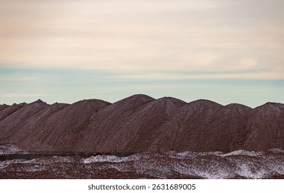 Bagger operation in surface mine. A backloader and a bucket wheel excavator in a lignite mine. Industrial stone production, crushed stone production, stone mining, crushed stone mining plant