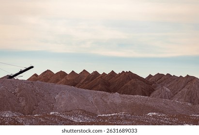 Bagger operation in surface mine. A backloader and a bucket wheel excavator in a lignite mine. Industrial stone production, crushed stone production, stone mining, crushed stone mining plant