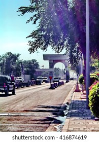 BAGHDAD, IRAQ - CIRCA 2007: Main Road In Front Of The Old US Embassy Compound, With Traffic Passing Under A Sadaam-era Arch