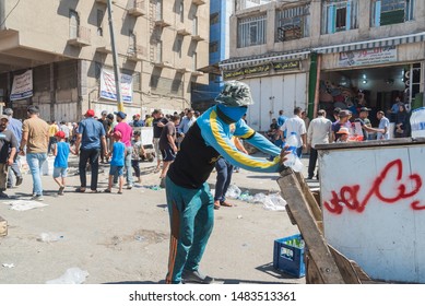 Baghdad, Iraq – July 5, 2019: Man Sells Water At A Street Market. The Day Is Warm.