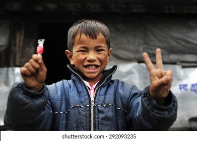 Baglung, Nepal. August 25-2010 Nepalese Child Is Happy For The Gift Of Candy