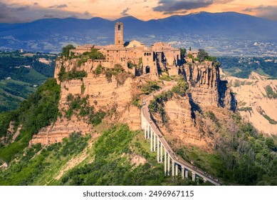 Bagnoregio, Italy. Dusk light over Civita di Bagnoregio, hilltop town founded by Etruscans in Valle dei Calanchi, Viterbo province, Lazio region. - Powered by Shutterstock