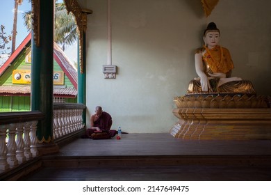 BAGO, MYANMAR - MARCH 03 : Unidentified monk pray at Shwemawdaw Pagoda, It's often referred to as the Golden God Temple. At 375 feet in height and the tallest pagoda in Myanmar on Mar 03, 2015