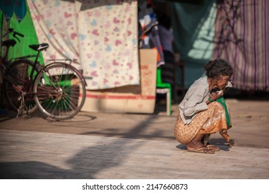 BAGO, MYANMAR - MARCH 03 : Unidentified old woman sitting on side street in old town on Mar 03, 2015