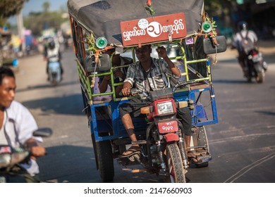 BAGO, MYANMAR - MARCH 04 : Unidentified Tuk Tuks or sam lor (3-wheeled) on the urban street, is a popular transportation used to be everyone's favorite way of asian country on March 04, 2015
