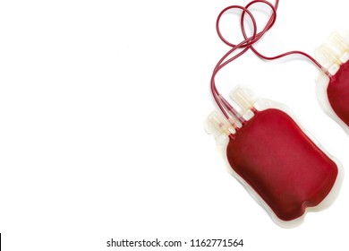 Bags of fresh blood or packed red cells, isolated on white background. Two bags are used for blood exchange transfusion of a patient with polycythemia. Bag of blood without labelled sticker.