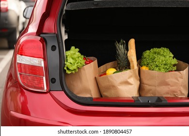 Bags Full Of Groceries In Car Trunk Outdoors, Closeup