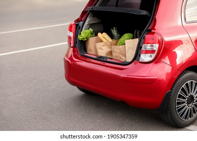 Bags Full Of Groceries In Car Trunk Outdoors