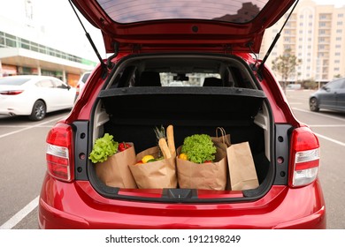 Bags Full Of Groceries In Car Trunk Outdoors