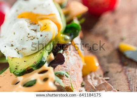 Similar – Image, Stock Photo Baked eggs in baguette bread. Breakfast with eggs and loaf
