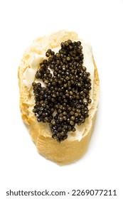 Baguette slice with black caviar and butter isolated over white. Natural sturgeon luxury delicacy sandwich closeup. Seafood delicatessen and bread appetizer. - Shutterstock ID 2269077211