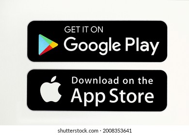 Bahawalpur, Pakistan - July 14, 2021: Download on the App Store and Get it on Google Play button icons, printed on paper