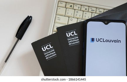 Bahia, Brazil - December 2, 2020. UCLouvain Logo On Smartphone Screen On Top Of Laptop. UCLouvain Is The Catholic University Of Louvain (Université Catholique De Louvain). 