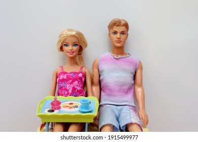 Bahia, Brazil - February 12, 2021. Barbie And Ken Dolls Having Lunch. Barbie Is Holding A Serving Tray.