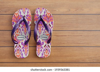 Bahia, Brazil - March 1, 2021: Brazilian Havaianas Flip Flops Sandals On Wooden Background. Havaianas Is A Brazilian Brand.