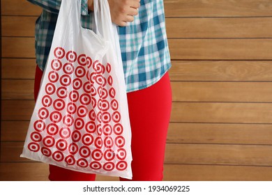 Bahia, Brazil - March 11, 2021: Woman Holding Target Store Shopping Bag. Hypermarket. American Retail Corporation. 