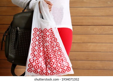 Bahia, Brazil - March 11, 2021: Woman Holding Target Store Shopping Bag. Hypermarket. American Retail Corporation. 