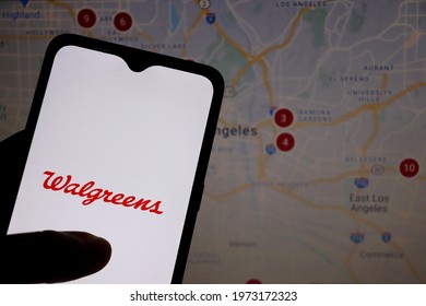 Bahia, Brazil - May 10, 2021: Walgreens logo on smartphone screen with USA map in the background.  