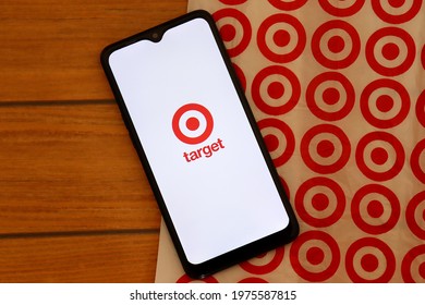 Bahia, Brazil - May 15, 2021: Target Store Logo On Smartphone Screen On Top Of Target Shopping Bag. Hypermarket.