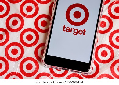 Bahia, Brazil - September 30, 2020.  Target Store Logo On Smartphone Screen On Top Of Target Shopping Bag. Hypermarket. 