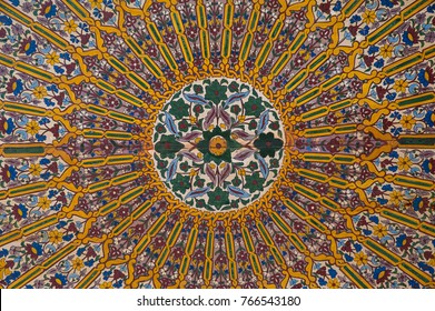 Bahia Palace, Marrakesh, Morocco - May 8, 2017: contemplative and intricate decoration of painted wood ceiling, a technique known as zouak painting, in Bahia Palace, in Marrakesh