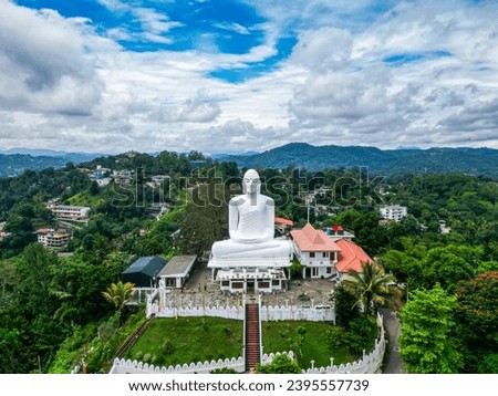 Bahirawakanda Sri Maha Bodhi Viharaya is a Theravada Buddhist Temple in Kandy, Sri Lanka, November 2023
Top aerial drone view of giant white Buddha statue, mountains, natural landscape