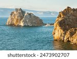 Baikal Lake in summer. Tourists sailed by ship to Olkhon Island along the Small Sea to the famous Shamanka Rock on a sunny August day. Summer outdoor recreation and water travel