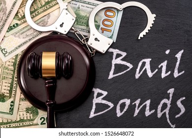 Bail Bond System, Bailing Out Of Jail And Innocent Until Proven Guilty Conceptual Idea With Judge Wooden Gavel, Dollar Banknotes And Handcuffs With Text Bail Bonds