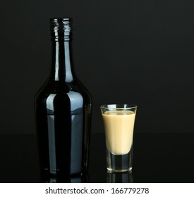 Baileys Liqueur In Bottle And Glass Isolated On Black