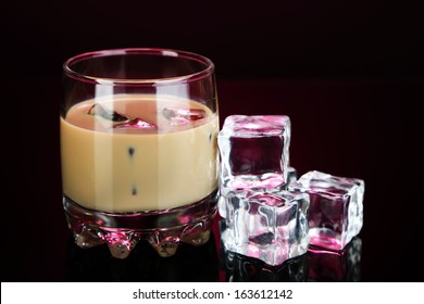 Baileys Liqueur In Glass On Pink Background