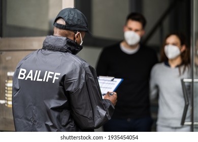 Bailiff Debt Collector At Door In Mask
