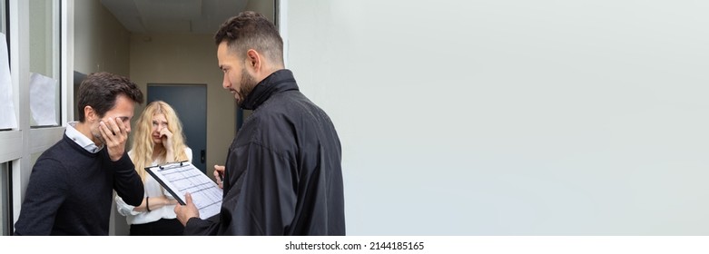 Bailiff Talking With Sad Couple At Home Entrance