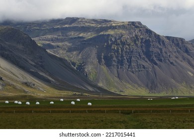 Bails Of Hay Backed By Mountains, Shot On The  Snæfellsnes Peninsula, Iceland.